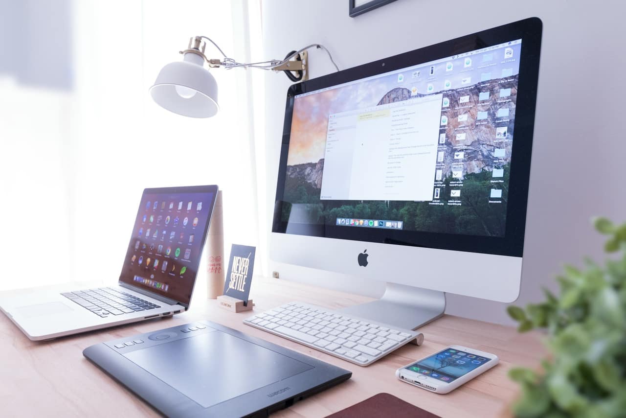Desktop computer and laptop on a desk
