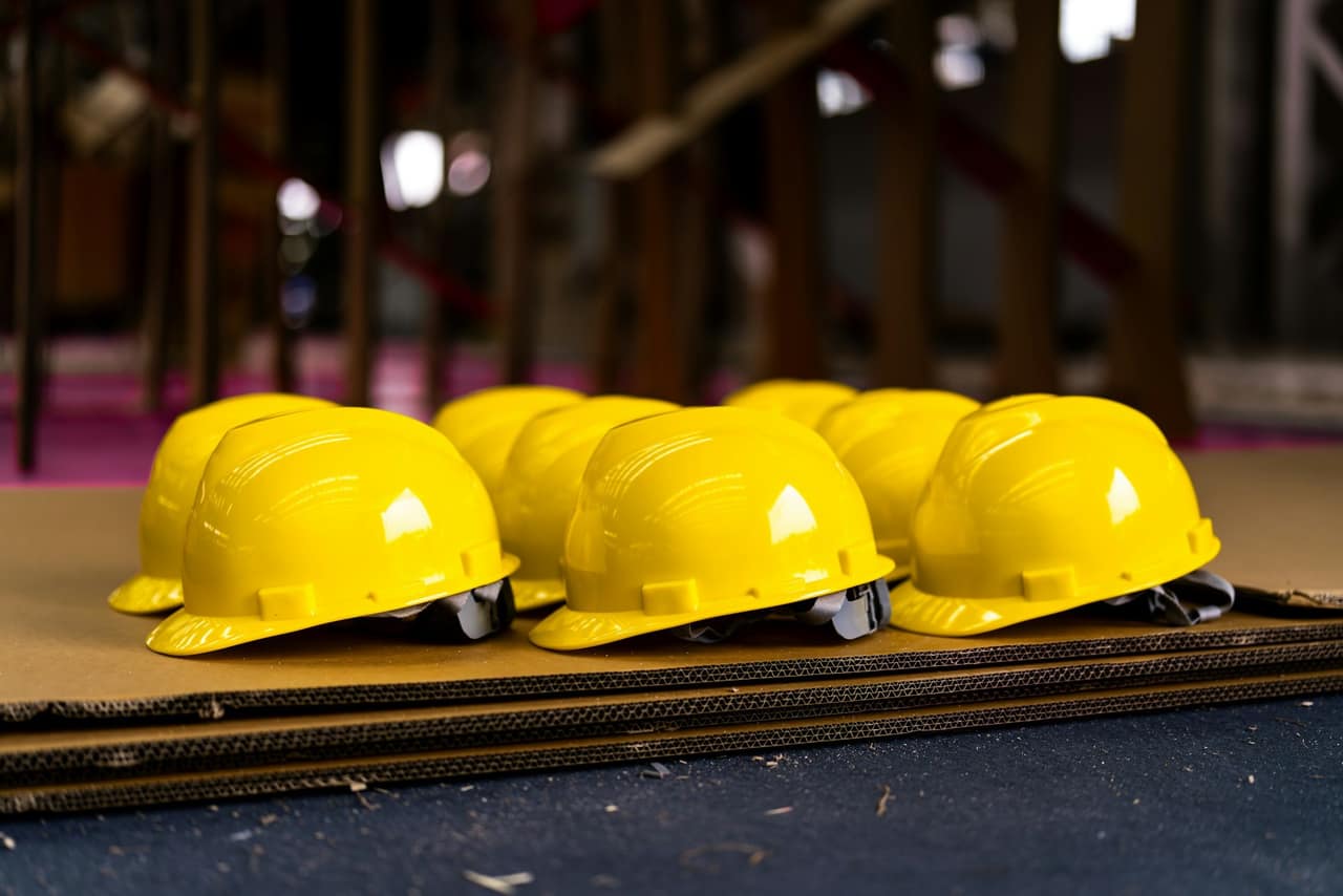 Rows of yellow safety helmets
